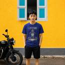 Rider wearing the Legend Riders Are Born in the 90s biker t-shirt in blue, front view of the print