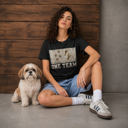 Woman wearing the Four Paws Two Feet One Team women's dog lover t-shirt in black, front print