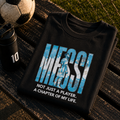 Messi A Chapter of My Life football fan t-shirt in black, folded to show the front print