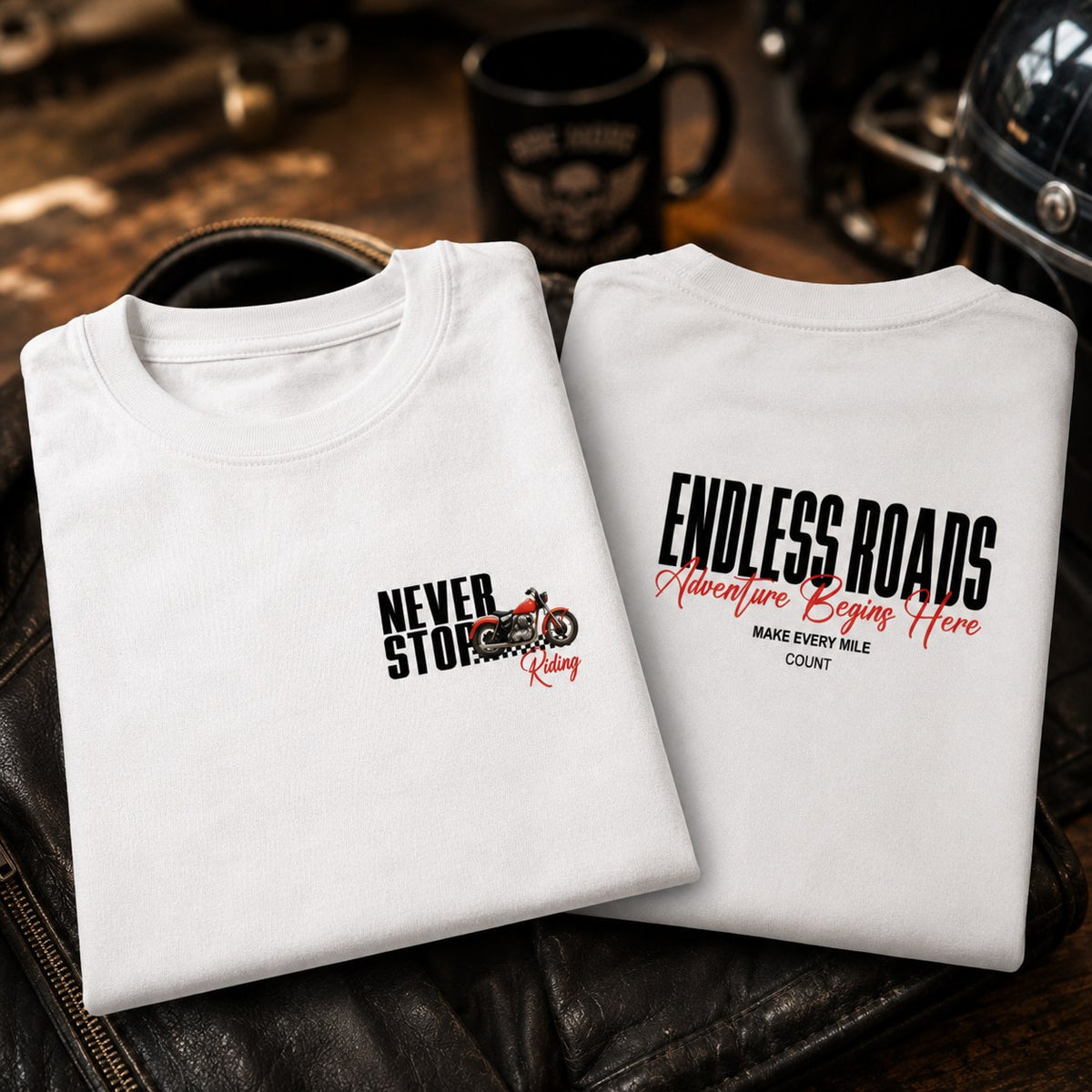 White Endless Roads oversized biker t-shirt folded, showing motorcycle graphic and back typography.