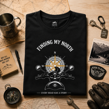 Folded black Finding My North premium biker T-shirt with vintage compass and motorcycle design.